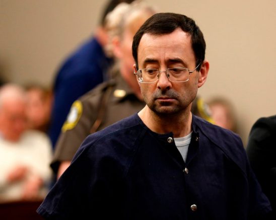 Former Michigan State University and USA Gymnastics doctor Larry Nassar addresses the court during the sentencing phase in Ingham County Circuit Court on January 24, 2018 in Lansing, Michigan. Disgraced former USA Gymnastics doctor Larry Nassar was sentenced to 40 to 175 years in prison on Wednesday for sexually abusing scores of young girls under the guise of medical treatment. "I've just signed your death warrant," Judge Rosemarie Aquilina said as she handed down the sentence after a week of gut-wrenching testimony by over 150 of Nassar's victims. / AFP PHOTO / JEFF KOWALSKY (Photo credit should read JEFF KOWALSKY/AFP via Getty Images)