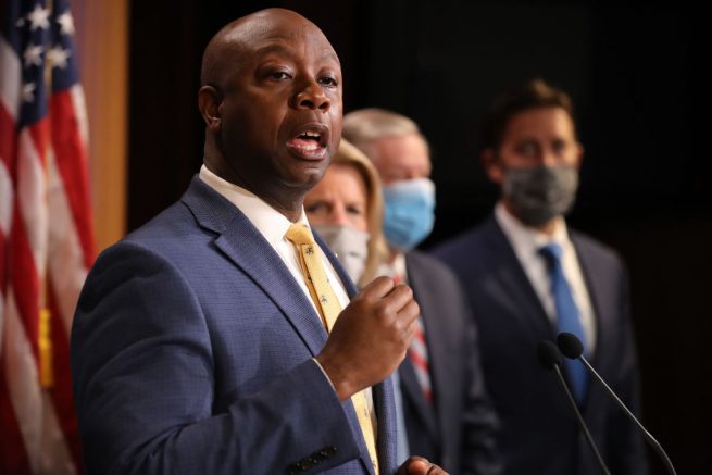 WASHINGTON, DC - JUNE 17: Sen. Tim Scott (R-SC) is joined by fellow Republican lawmakers for a news conference to unveil the GOP's legislation to address racial disparities in law enforcement at the U.S. Capitol June 17, 2020 in Washington, DC. Scott, the Senate's lone black Republican, lead the effort to write the Just and Unifying Solutions to Invigorate Communities Everywhere (JUSTICE) Act, which discourages the use of chokeholds, requires police departments to release more information on use of force and no-knock warrants, and encourages body cameras and better training. (Photo by Chip Somodevilla/Getty Images)