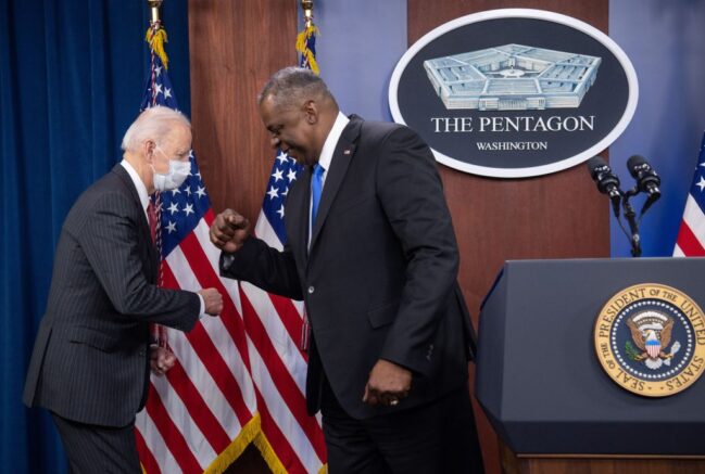 US President Joe Biden elbow bumps US Secretary of Defense Lloyd Austin (R) as he arrives to speak during a visit to the Pentagon in Washington, DC, February 10, 2021. (Photo by SAUL LOEB / AFP) (Photo by SAUL LOEB/AFP via Getty Images)