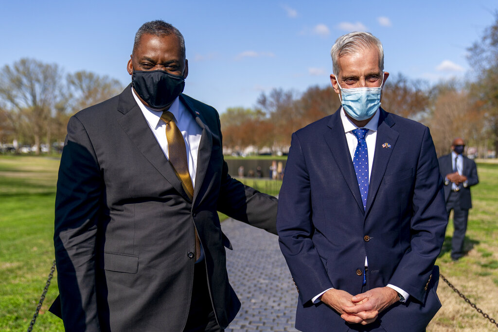 Secretary of Defense Lloyd Austin and Veterans Affairs Secretary Denis McDonough pose for a photograph before laying a wreath at the Vietnam Veterans Memorial, Monday, March 29, 2021, in Washington. (AP Photo/Andrew Harnik)