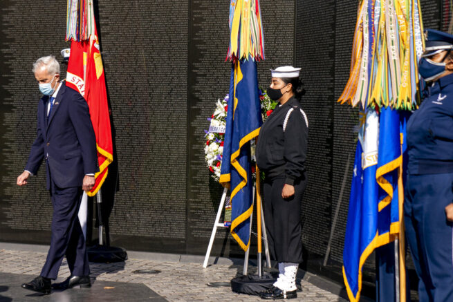 Veterans Affairs Secretary Denis McDonough lays a wreath at the Vietnam Veterans Memorial, Monday, March 29, 2021, in Washington. (AP Photo/Andrew Harnik)