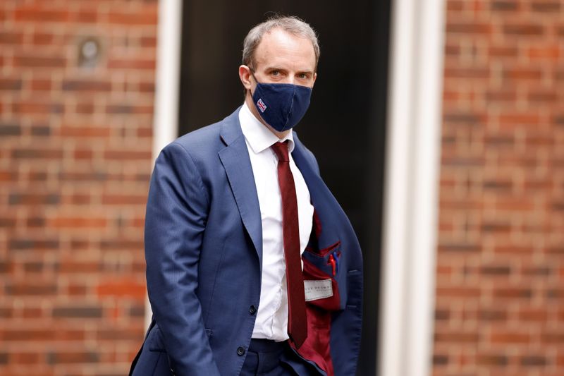 FILE PHOTO: Britain's Foreign Affairs Secretary Dominic Raab walks outside Downing Street in London