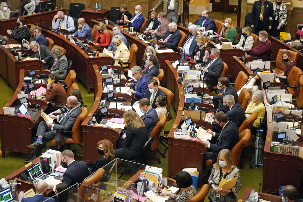 The Utah House of Representatives work on the House floor Friday night, March 5, 2021, in Salt Lake City. The Utah Legislature is wrapping up its business for the year Friday evening. Lawmakers have already tackled a number of issues this year during a session that was conducted partially remotely because of the coronavirus pandemic. (AP Photo/Rick Bowmer)