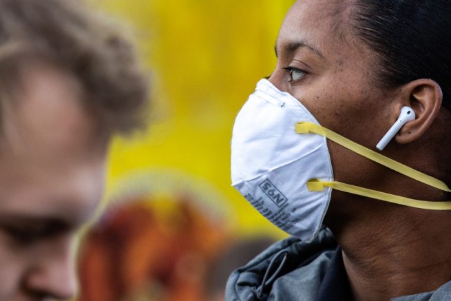 NEW YORK, NY - MARCH 09: A woman wearing a protective mask is seen in Union Square on March 9, 2020 in New York City. There are now 20 confirmed coronavirus cases in the city including a 7-year-old girl in the Bronx. (Photo by Jeenah Moon/Getty Images)