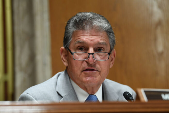 WASHINGTON, DC - JUNE 16: Sen. Joe Manchin (D-WV) questions Ajit Pai, Chairman of the Federal Communications Commission, during his testimony before an oversight hearing to examine the Federal Communications Commission spectrum auctions program for fiscal year 2021 on June 16, 2020 in Washington, DC. The hearing was held by the Senate Appropriations Subcommittee on Financial Services and General Government. (Photo by Toni Sandys-Pool/Getty Images)
