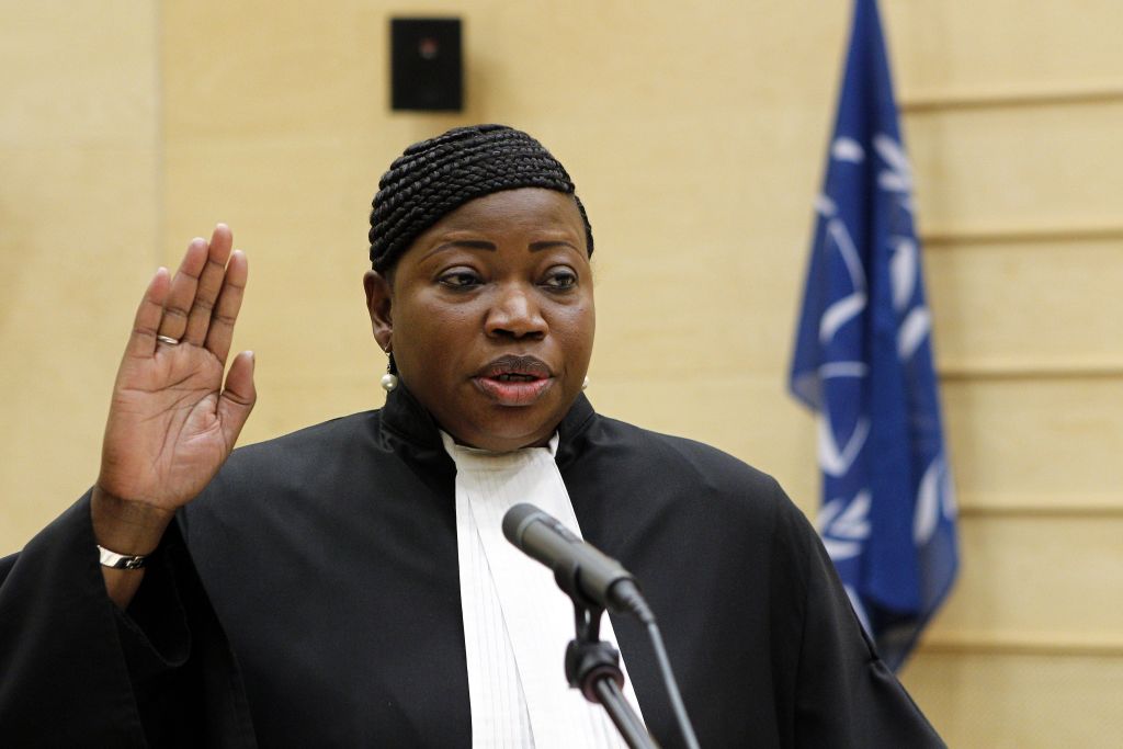 Gambian war crimes lawyer Fatou Bensouda takes the oath during a swearing-in ceremony as the International Criminal Court's new chief prosecutor in The Hague, on June 15, 2012. The 51-year-old Bensouda is the first woman and the first African to head the team of prosecutors at the tribunal, which is currently investigating 15 cases in seven countries, all of them African. Taking the oath before ICC judges and a public gallery packed with foreign diplomats and dignitaries, Bensouda vowed to continue to pursue those wanted for crimes of genocide, war crimes and crimes against humanity. AFP PHOTO/POOL/ANP/ BAS CZERWINSKI netherlands out (Photo by BAS CZERWINSKI / ANP / AFP) (Photo by BAS CZERWINSKI/ANP/AFP via Getty Images)