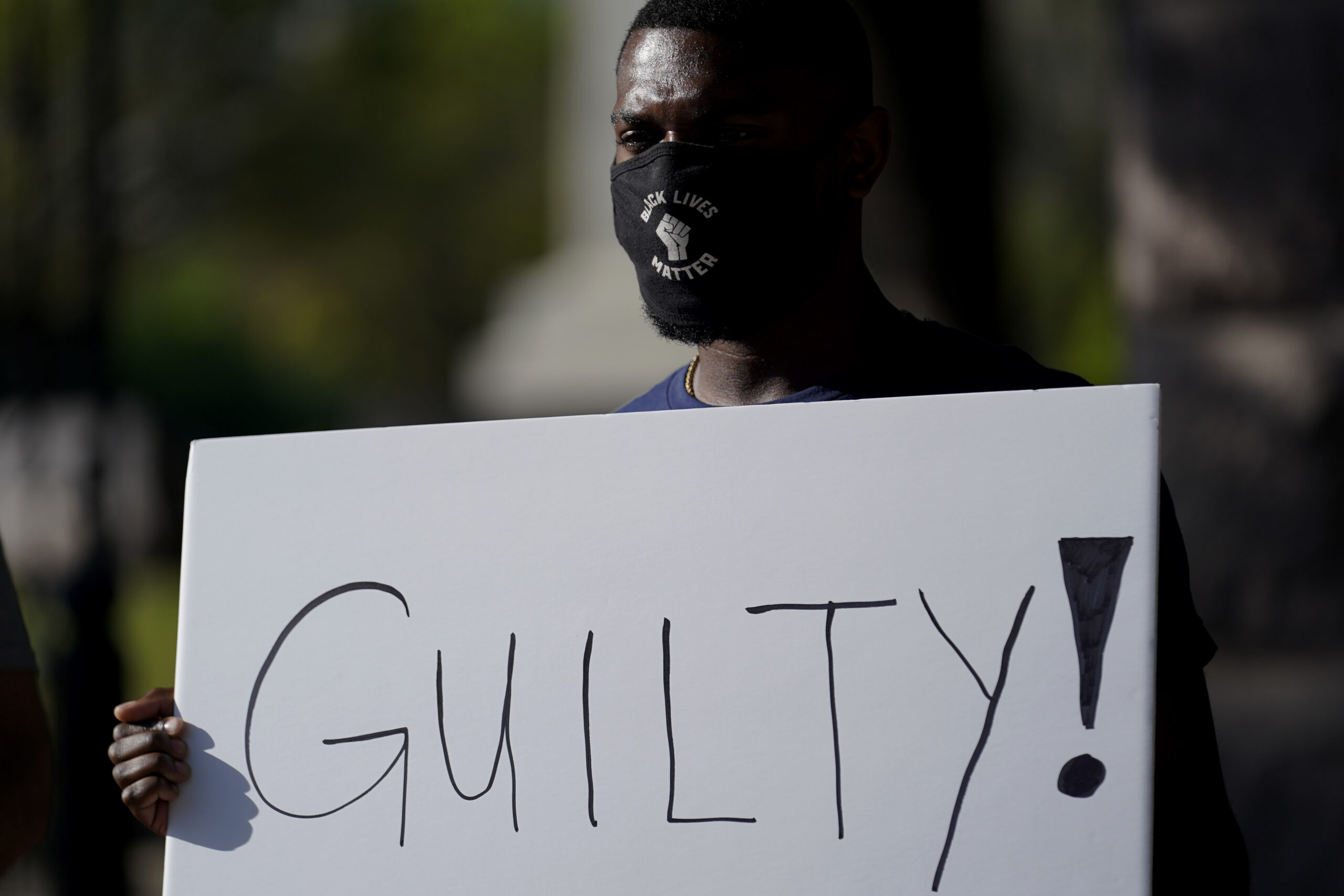 Mike James stands with a sign reading "Guilty" at the Texas Capitol, Tuesday, April 20, 2021, in Austin, Texas, after the guilty verdict in the murder trial of former Minneapolis police Officer Derek Chauvin was announced in the death of George Floyd. (AP Photo/Eric Gay)