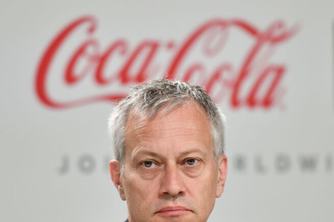 Coca-Cola President and CEO James Quincey attends a press conference with International Olympic Committee (IOC) president and China Mengniu Dairy CEO and Executive Director, as part of the 134th Session of the International Olympic Committee (IOC) at the SwissTech Convention Centre in Lausanne, on June 24, 2019. - The International Olympic Committee (IOC) in Lausanne, Switzerland, will elect in a final vote on June 24, 2019 the host city for the 2026 Winter Olympics. The two remaining host cities in the election process are Stockholm-Are, Sweden, and MilanCortina d'Ampezzo, Italy. (Photo by FABRICE COFFRINI / AFP) (Photo credit should read FABRICE COFFRINI/AFP via Getty Images)