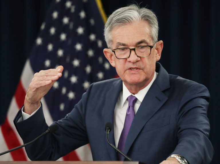 Fed holds interest rates near zero, sees faster growth and higher inflation