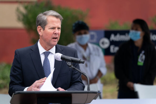 SAVANNAH, GA - DECEMBER 15: Georgia Gov. Brian Kemp speaks to the media before health care workers receive the Pfizer-BioNTech COVID-19 vaccine outside of the Chatham County Health Department on December 15, 2020 in Savannah, Georgia. Kemp was on hand to witness initial administering of vaccines in the state. (Photo by Sean Rayford/Getty Images)