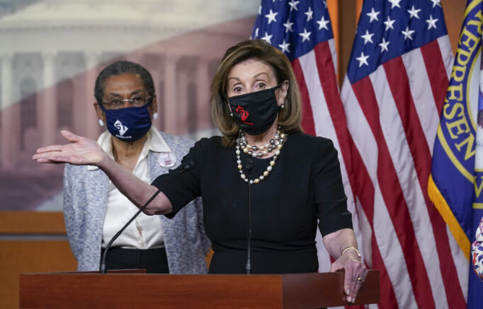 In this April 21, 2021, photo, House Speaker Nancy Pelosi, D-Calif., joins Del. Eleanor Holmes-Norton, D-D.C., left, at a news conference ahead of the House vote on H.R. 51, the Washington, DC Admission Act, on Capitol Hill in Washington. Proponents of statehood for Washington, D.C., face a milestone moment in their decades-long movement to reshape the American political map. (AP Photo/J. Scott Applewhite)