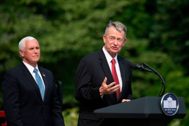 US Vice President President Mike Pence(L) listens as Idaho Governor Brad Little(R-ID) speaks at the White House in Washington, DC, on July 16, 2020, during an event on Rolling Back Regulations to Help All Americans on the South Lawn at the White House on July 16, 2020 in Washington,DC. (Photo by JIM WATSON / AFP) (Photo by JIM WATSON/AFP via Getty Images)