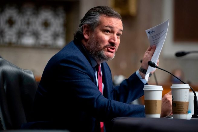 Republican Senator from Texas Ted Cruz holds a copy of a 2019 speech by Linda Thomas-Greenfield that was delivered at 'Confucius Institute' at Savannah State University, during the Senate Foreign Relations Committee hearing on the nomination of Linda Thomas-Greenfield to be the United States Ambassador to the United Nations, on Capitol Hill in Washington, DC, on January 27, 2021. (Photo by MICHAEL REYNOLDS / POOL / AFP) (Photo by MICHAEL REYNOLDS/POOL/AFP via Getty Images)