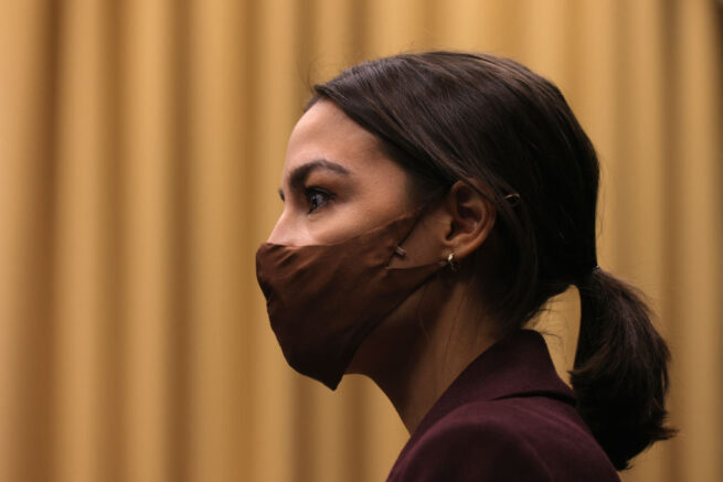 WASHINGTON, DC - MARCH 18: U.S. Rep. Alexandria Ocasio-Cortez (D-NY) listens during a news conference to introduce the "Puerto Rico Self-Determination Act of 2021" at Rayburn House Office Building on Capitol Hill March 18, 2021 in Washington, DC. (Photo by Alex Wong/Getty Images)