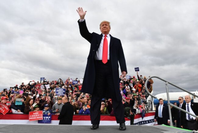  TOPSHOT - US President Donald Trump arrives for a "Make America Great Again" rally at Bozeman Yellowstone International Airport, November 3, 2018 in Belgrade, Montana. - With rallies in Montana and Florida, a state he had already visited on Wednesday, Trump on Saturday is keeping up his relentless campaign schedule before Tuesday's ballot, which has become a referendum on his unconventional presidency. (Photo by Nicholas Kamm / AFP) (Photo credit should read NICHOLAS KAMM/AFP via Getty Images)