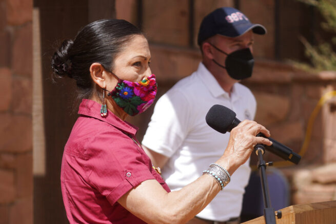 U.S. Interior Secretary Deb Haaland speaks while Utah Gov. Spencer Cox looks on during a news conference following a visit to Bears Ears National Monument Thursday, April 8, 2021, in Blanding, Utah. Haaland is visiting Utah as she prepares to submit a 