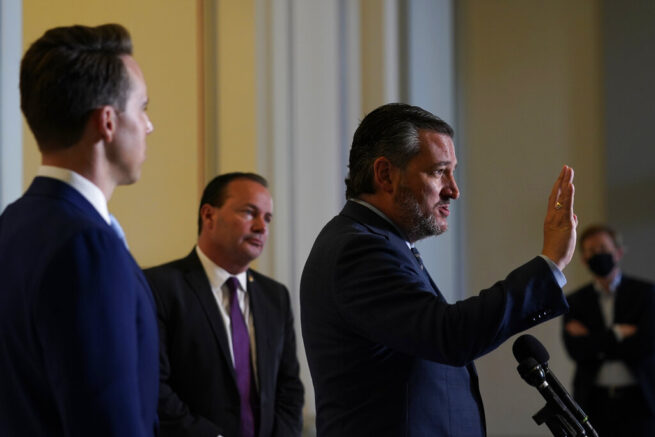 Sen. Ted Cruz, R-Texas, right, standing with Sen. Josh Hawley, R-Mo., left, and Sen. Mike Lee, R-Utah, center, talks about legislation to end Major League Baseball's special immunity from antitrust laws during a news conference on Capitol Hill in Washington, Tuesday, April 13, 2021. (AP Photo/Susan Walsh)