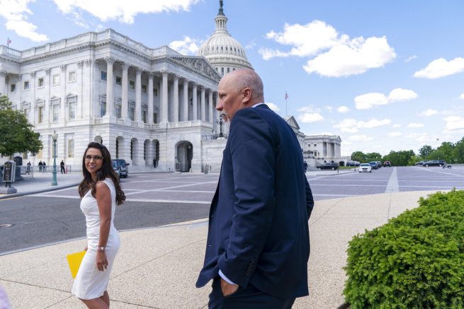 Rep. Lauren Boebert, R-Colo., left, looks back at Rep. Chip Roy, R-Texas, as they leave a news conference, Wednesday, May 12, 2021, after expressing their opposition to "critical race theory," on Capitol Hill in Washington. (AP Photo/Jacquelyn Martin)