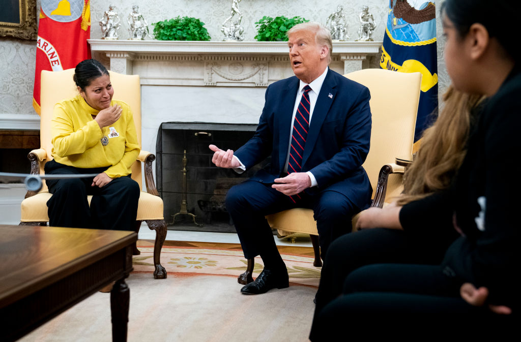 WASHINGTON, DC - JULY 30: U.S. President Donald Trump speaks during a meeting with Gloria Guillen, mother of missing Fort Hood soldier Vanessa Guillen, in the Oval Office of the White House July 30, 2020 in Washington, DC. Guillen went missing from her post at Fort Hood, Texas, on April 22 but her remains were not discovered until June 30. A fellow soldier, Aaron David Robinson, was the main suspect in Guillen's murder and shot himself to death as he was approached by police. (Photo by Doug Mills-Pool/Getty Images)