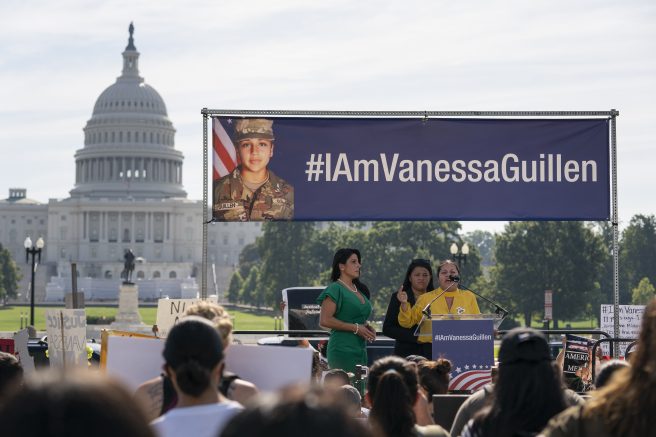 FILE - In this July 30, 2020, file photo slain Army Spc. Vanessa Guillen's mother Gloria Guillen, right, joined by Vanessa's sister Lupe Guillen, center, and family attorney Natalie Khawam, speaks as she cries during a news conference on the National Mall in front of Capitol Hill in Washington. The Army said Friday, April 30, 2021, that it has taken disciplinary action against 21 officers and non-commissioned officers at Fort Hood, Texas, in connection with death last year of Spc. Vanessa Guillen, who was missing for about two months before her remains were found. (AP Photo/Carolyn Kaster, File)