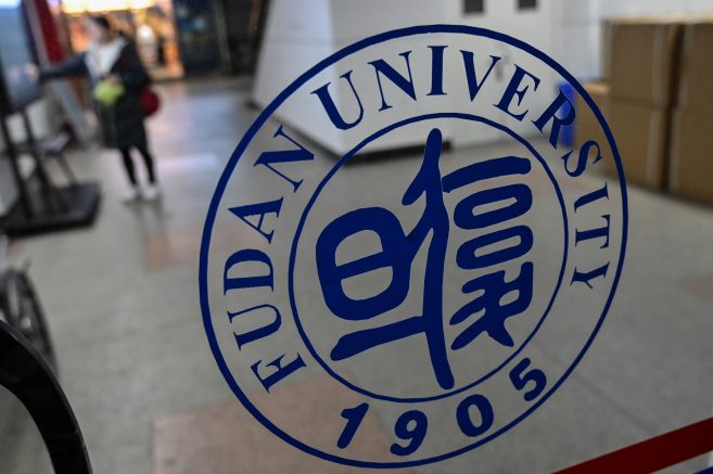 In this picture taken on December 18, 2019, a Fudan University sign is seen on the campus in Shanghai. - One of China's top universities has removed references to "freedom of thought" from its official charter, triggering a rare act of student defiance, while two other institutions have moved to strengthen their allegiance to President Xi Jinping. Video that circulated this week showed students at Shanghai's Fudan University gathering to sing the school song -- which extols "academic independence and freedom of thought" -- in an apparent protest against the move. (Photo by HECTOR RETAMAL / AFP) (Photo by HECTOR RETAMAL/AFP via Getty Images)