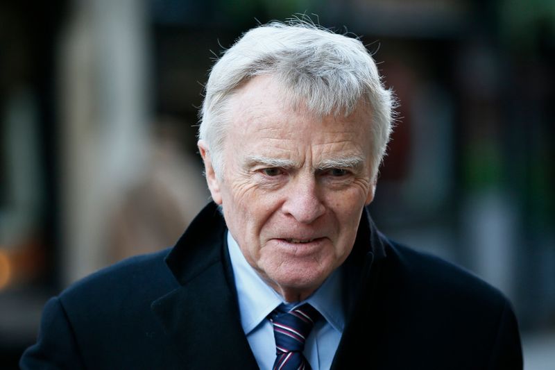 FILE PHOTO: Former FIA racing chief Max Mosley leaves the High Court in London