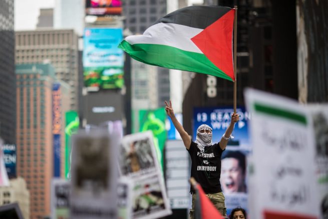 NEW YORK, NY - MAY 18: Members of the Palestinian community, fellow Muslims and their supporters rally in support of the Palestinian people in the wake of the recent violence in the Gaza Strip, during a rally in Times Square, May 18, 2018 in New York City. Israeli soldiers killed over 50 Palestinian protestors earlier this week during violent demonstrations on the Gaza-Israel border, which also coincided with the controversial opening of the new U.S. Embassy in Jerusalem. (Photo by Drew Angerer/Getty Images)