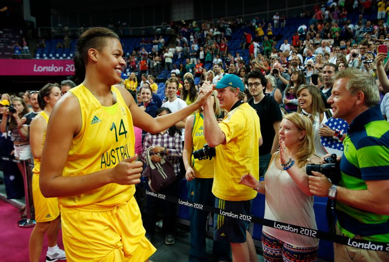 Australia's Cambage celebrates with fans after the women's bronze medal basketball match against Russia at the North Greenwich Arena during the London 2012 Olympic Games