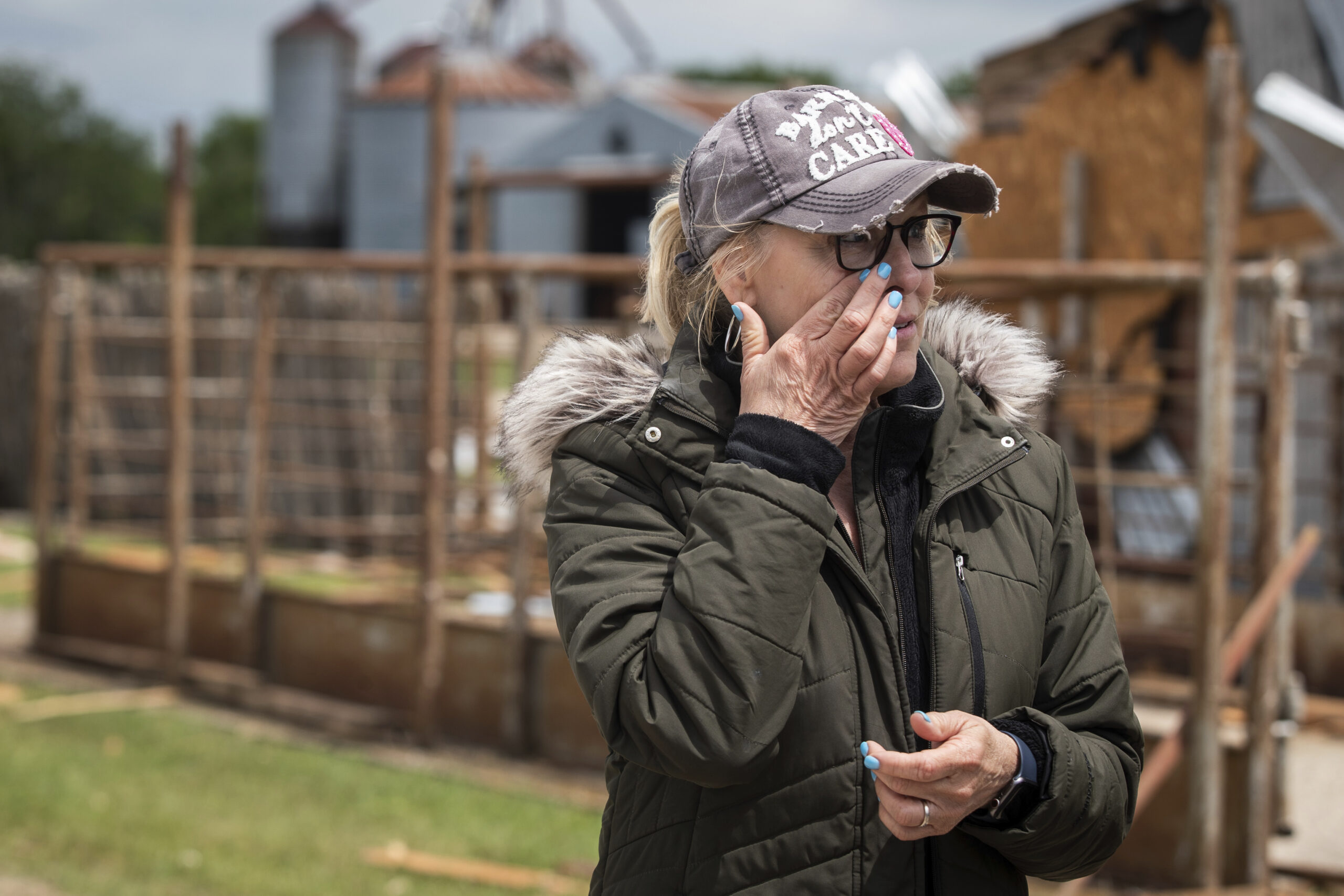  Cathy Haley wipes away tears while looking over damage caused by a tornado Tuesday, May 4, 2021, at Barn on the Brazos in Blum, Texas. (Yffy Yossifor/Star-Telegram via AP)