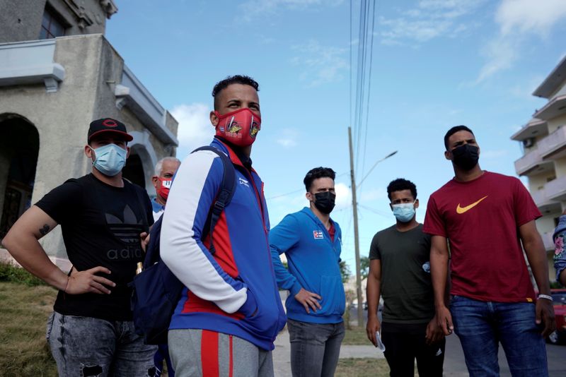 FILE PHOTO: Players of the Cuba's national baseball team wait to enter the U.S. Embassy in Havana