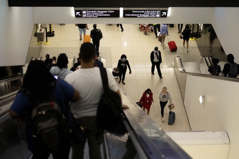 Passengers walk along terminal B of Hartsfield-Jackson Atlanta International Airport in Atlanta, Georgia