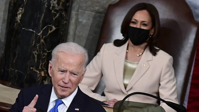 Kamala Harris watches Joe Biden deliver his address to a joint session of Congress. (Jim Watson/Pool via AP)