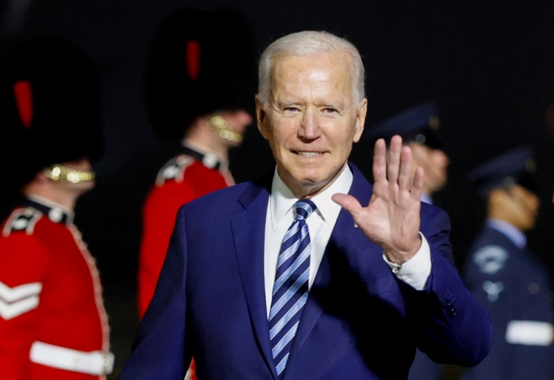 FILE PHOTO: U.S. President Joe Biden waves upon arrival at Cornwall Airport Newquay, near Newquay