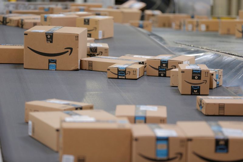 FILE PHOTO: Packages travel along a conveyor belt inside of an Amazon fulfillment center in Robbinsville, New Jersey