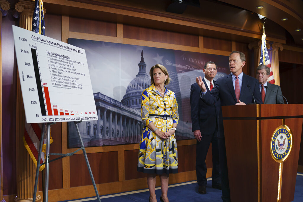 In this photo taken Thursday, May 27, 2021, Sen. Shelley Moore Capito, R-W.Va., the GOP's lead negotiator on a counteroffer to President Joe Biden's infrastructure plan, listens at left as she is joined at a news conference by, from left, Sen. John Barrasso, R-Wyo., Sen. Pat Toomey, R-Pa., chairman of the Senate Republican Conference, and Sen. Roy Blunt, R-Mo., at the Capitol in Washington. Biden and the West Virginia senator will meet Wednesday afternoon to work on their differences. (AP Photo/J. Scott Applewhite)