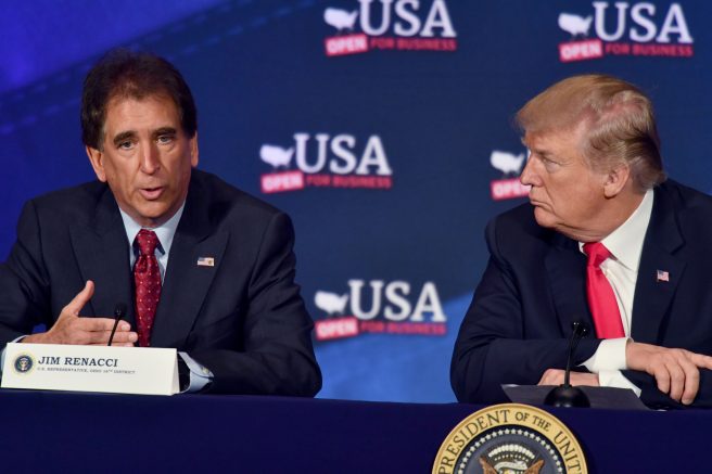 President Donald Trump, right, listens to Jim Renacci, left, during a roundtable discussion in Cleveland, Ohio. (NICHOLAS KAMM/AFP via Getty Images)