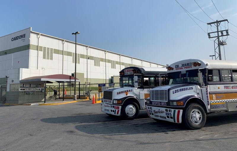 FILE PHOTO: Commuter buses are parked outside the Tridonex auto-parts plant, owned by Philadelphia-based Cardone Industries, in Matamoros