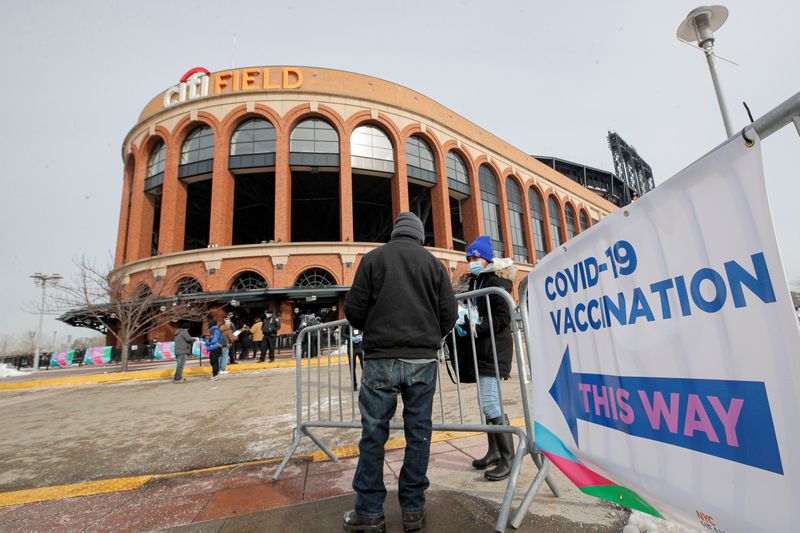 A man arrives to receive the coronavirus disease (COVID-19) vaccine outside Citi Field, the home stadium of MLB's New York Mets in Queens, New York