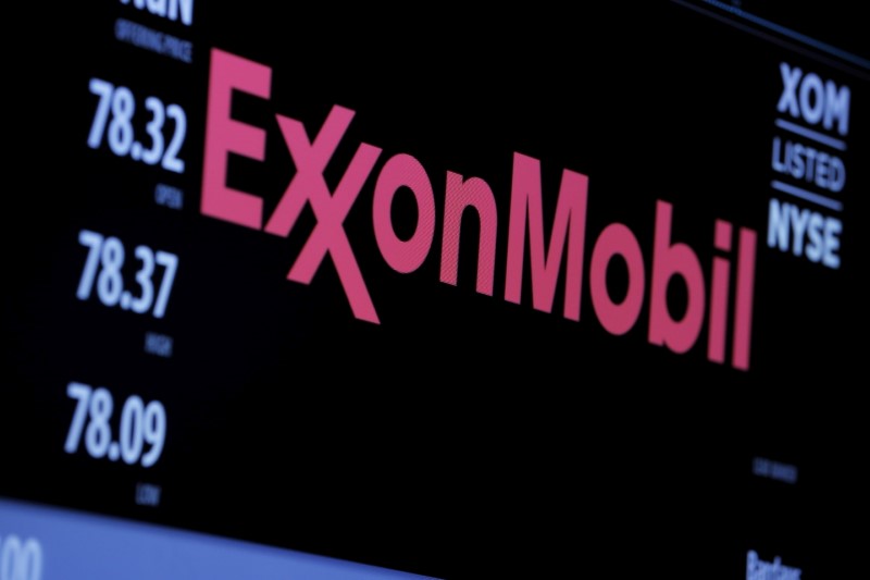 FILE PHOTO: The logo of Exxon Mobil Corp is shown on a monitor above the floor of the New York Stock Exchange in New York