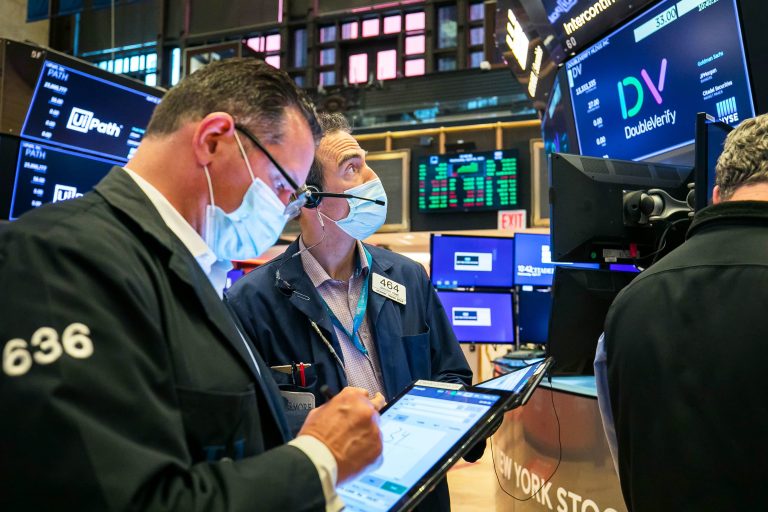 Nasdaq rises to record high as tech stocks climb, Dow falls nearly 200 points