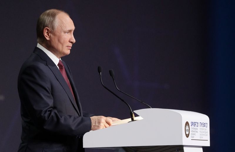 Russian President Putin delivers a speech during a session of the St. Petersburg International Economic Forum