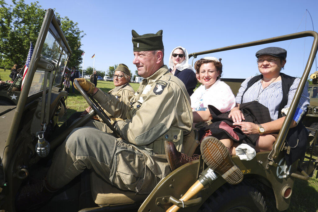 World War II history enthusiasts photographed in Normandy. (AP Photo/David Vincent)
