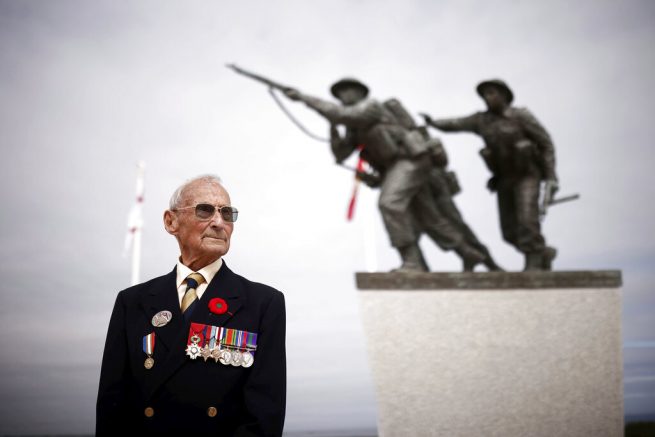 Veteran David Mylchreest, 97, poses prior to the official opening ceremony of the British Normandy Memorial at Ver-sur-Mer in France, Sunday June 6, 2021, on the anniversary of the D-Day landings. Several ceremonies took place on Sunday to commemorate the 77th anniversary of D-Day that led to the liberation of France and Europe from the German occupation. On June 6, 1944, more than 150,000 Allied troops landed on code-named beaches, carried by 7,000 boats. (Stephane Mahe/Pool Photo via AP