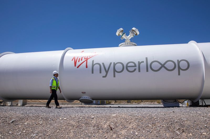 FILE PHOTO: Josh Giegel, co-founder and CEO of Virgin Hyperloop, walks next to a hyperloop tube at the company's hyperloop facility near Las Vegas