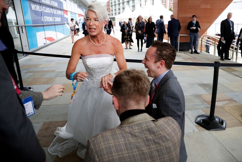 FILE PHOTO: Newspaper columnist Katie Hopkins arrives dressed in a wedding dress at the Conservative Party's conference in Manchester