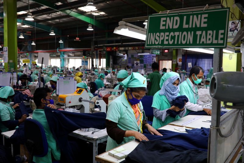 FILE PHOTO: Garment employees work at Fakhruddin Textile Mills Limited in Gazipur