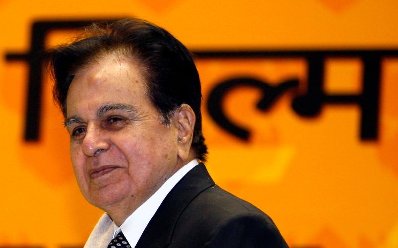 FILE PHOTO: Bollywood star Dilip Kumar smiles after receiving an award in New Delhi