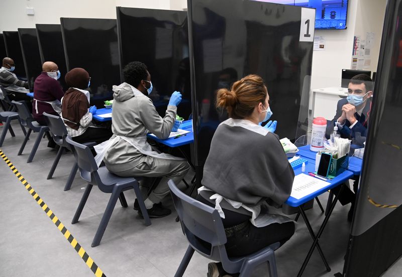 FILE PHOTO: Students take coronavirus disease (COVID-19) tests at Harris Academy Beckenham, in London