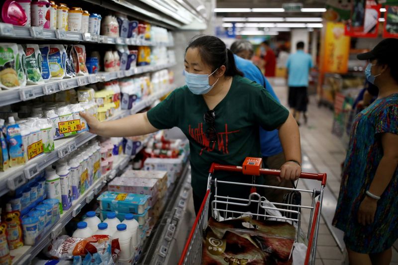 Woman shops inside a supermarket in Beijing