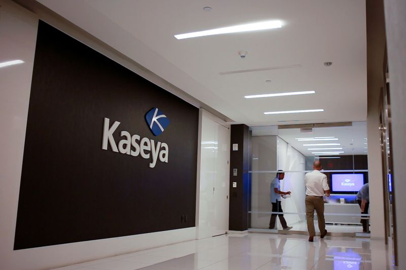 Staff enter the headquarters of information technology firm Kaseya in Miami